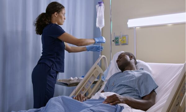 Nurse setting up IV drip